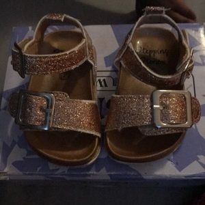 Baby glitter gold sandals.